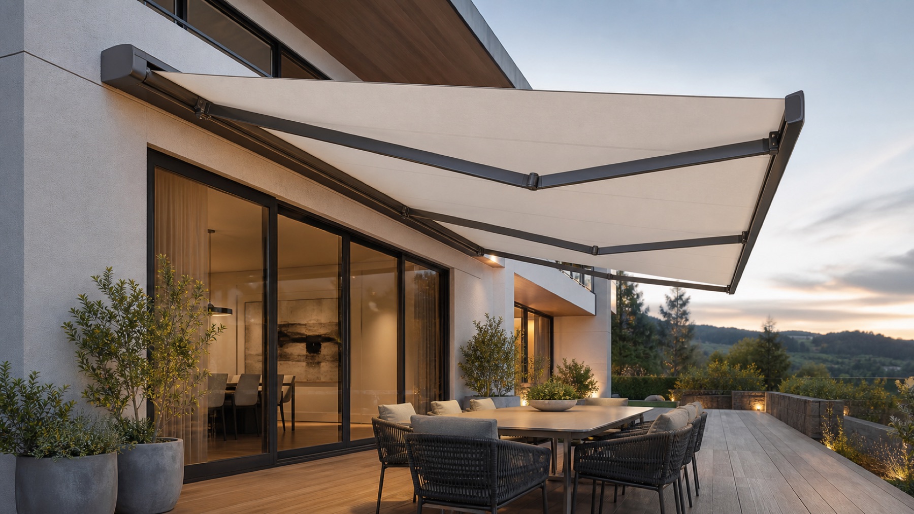 Folding arm awning extended over a modern outdoor dining area