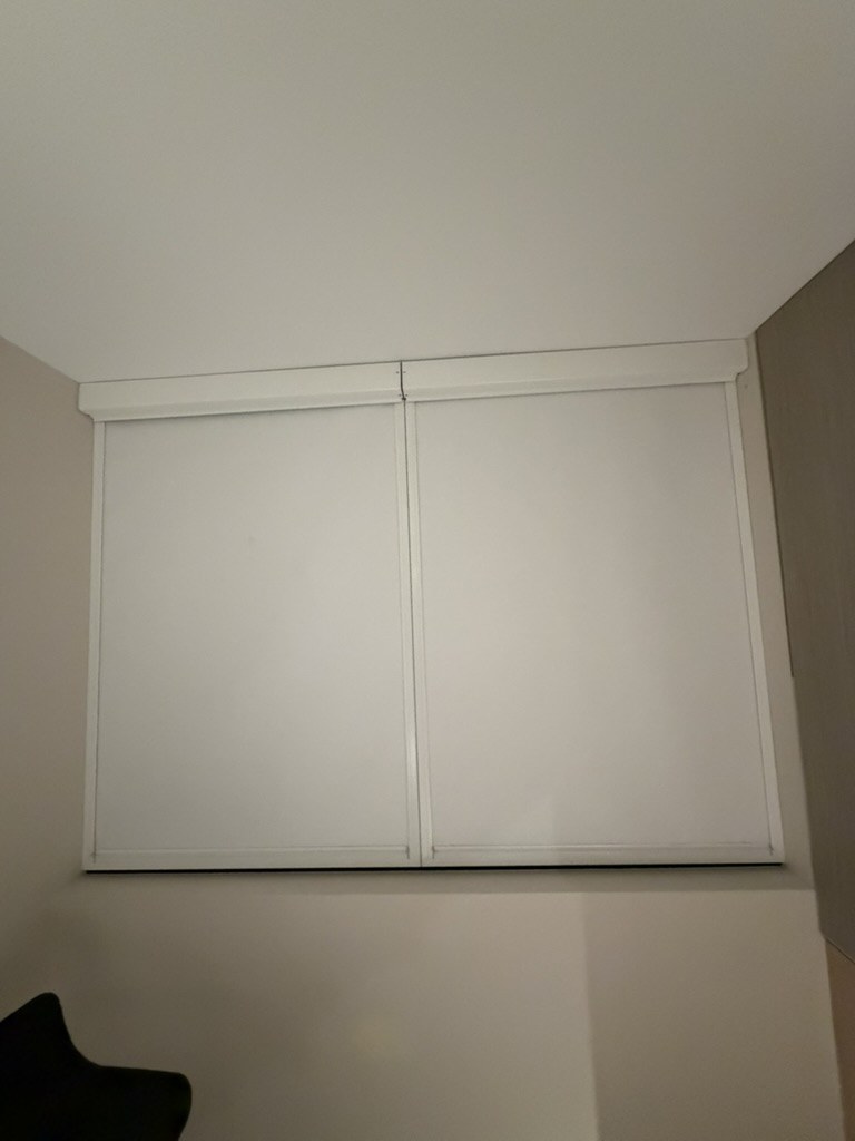 Blockout Ziptrak Interior blind panels closed over a clinic window