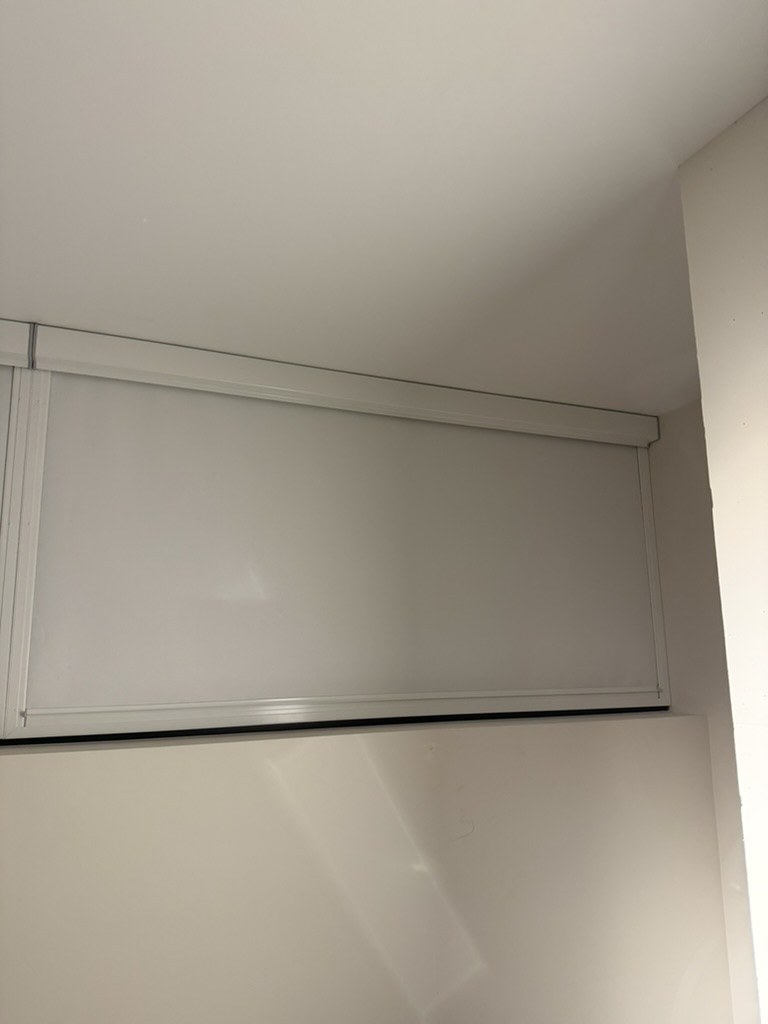 Ziptrak Interior side track detail reducing light gaps in a treatment room