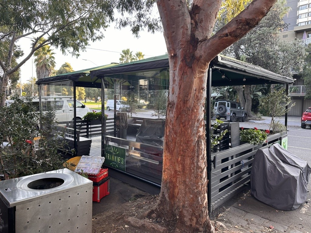 Clear PVC cafe blinds around Frankie's Top Shop outdoor seating