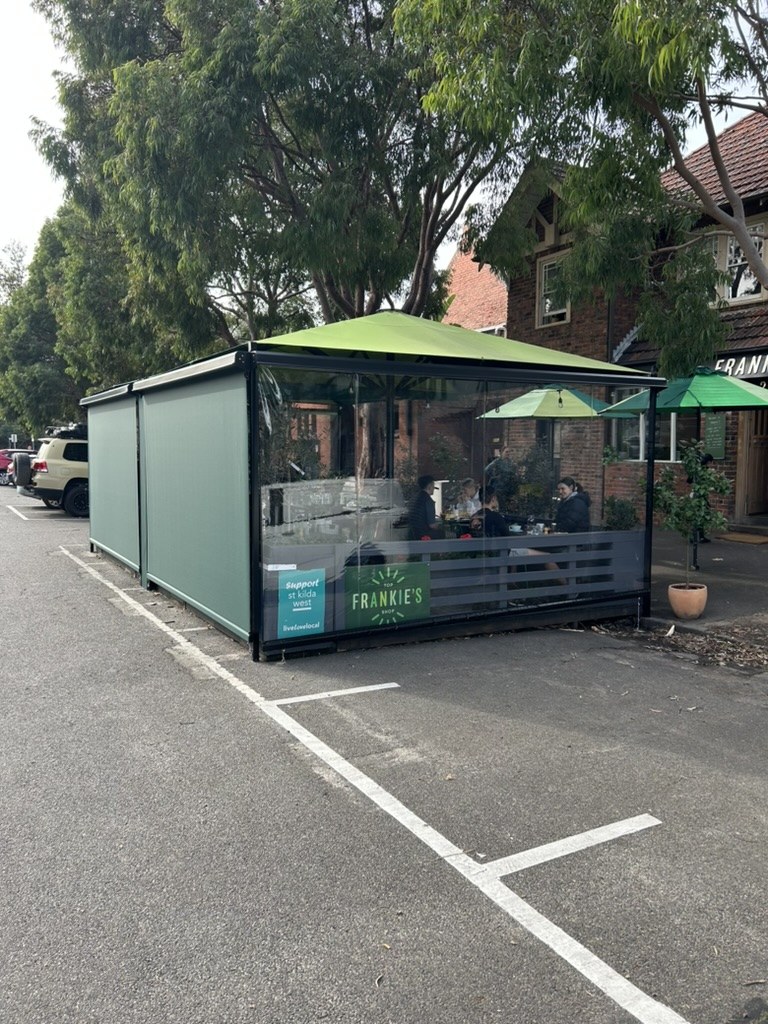 Frankie's Top Shop outdoor dining enclosure with clear PVC and mesh blinds