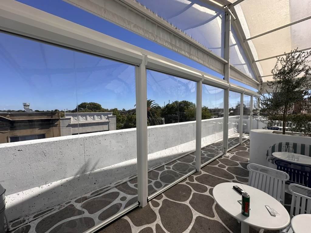 Motorised Clear PVC Ziptrak blinds and fixed panels at Olympia Restaurant in Oakleigh