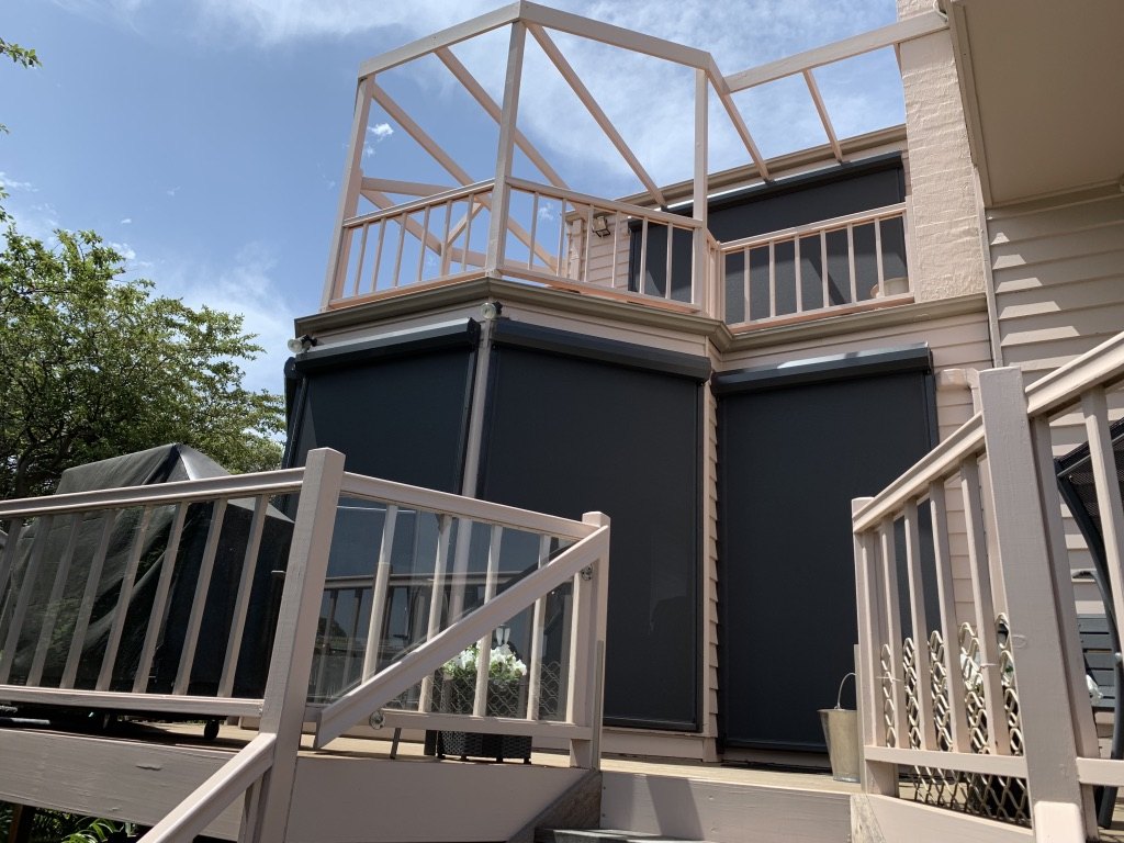 Rye residential exterior with motorised Ziptrak blinds and deck shading