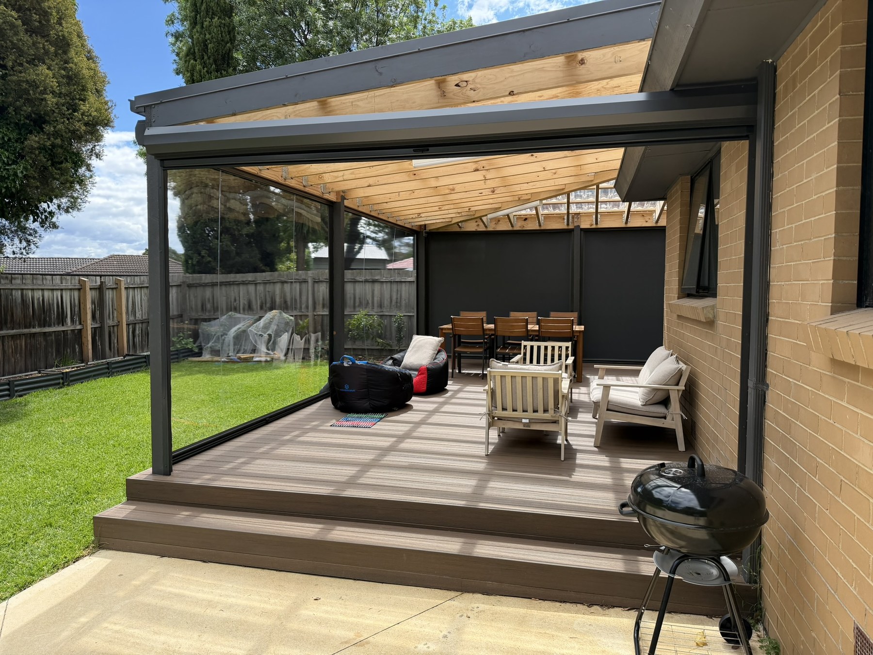 Wantirna residential alfresco area enclosed with clear PVC and 99 percent blockout mesh Ziptrak blinds