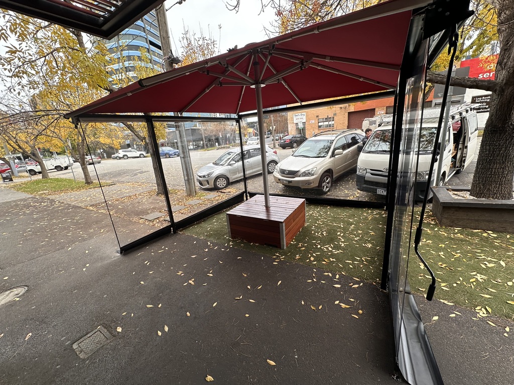 Clear PVC straight drop blinds around a commercial outdoor area