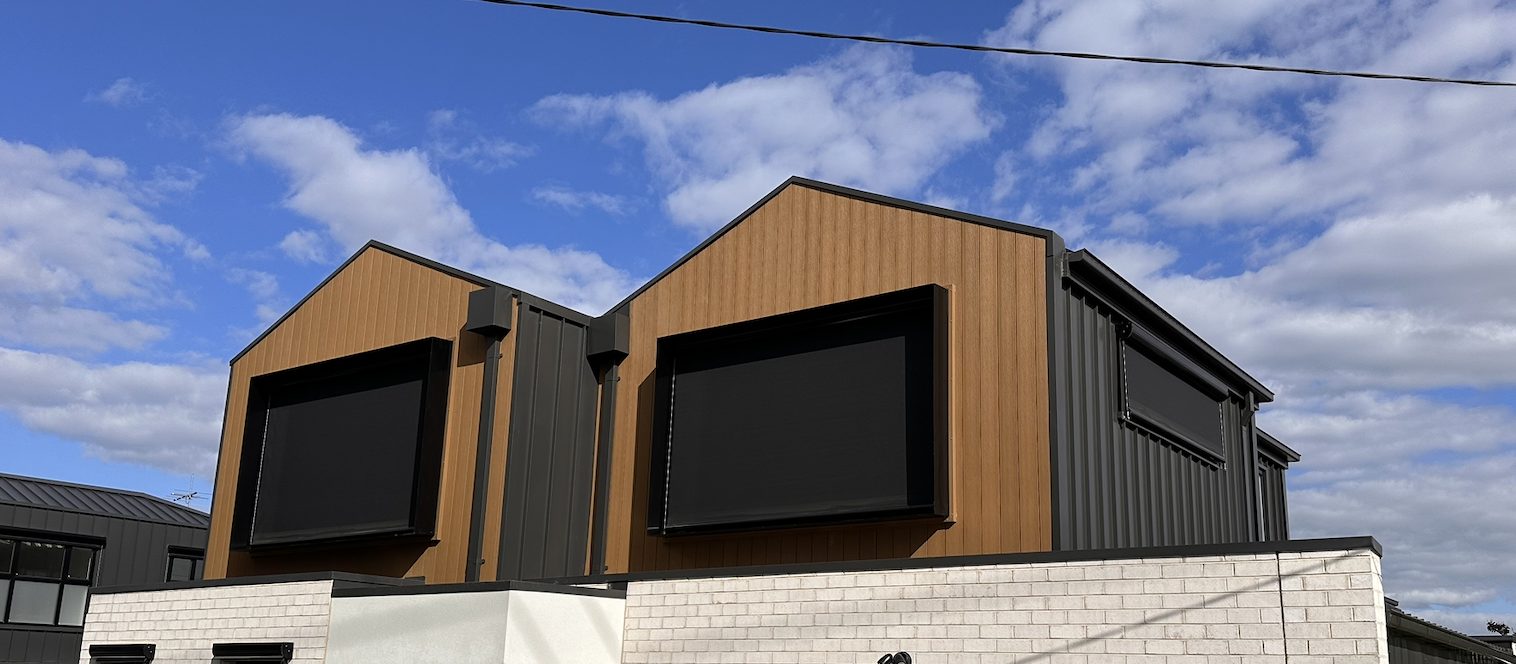 Wire guided blinds on a modern facade
