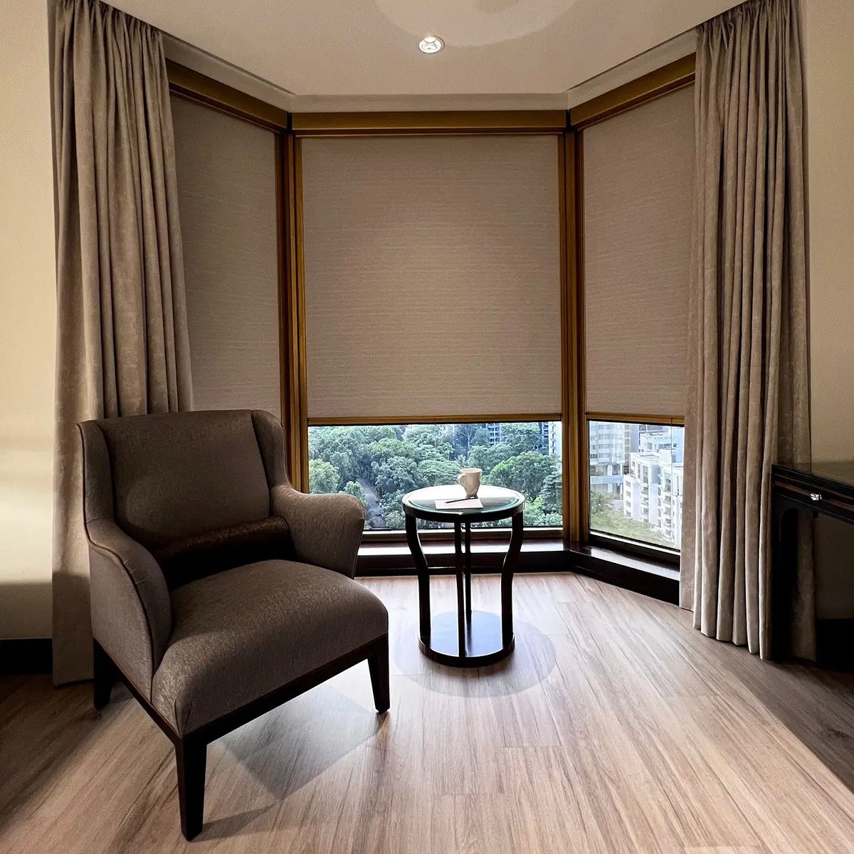 Ziptrak Interior blinds fitted to corner windows in a furnished room