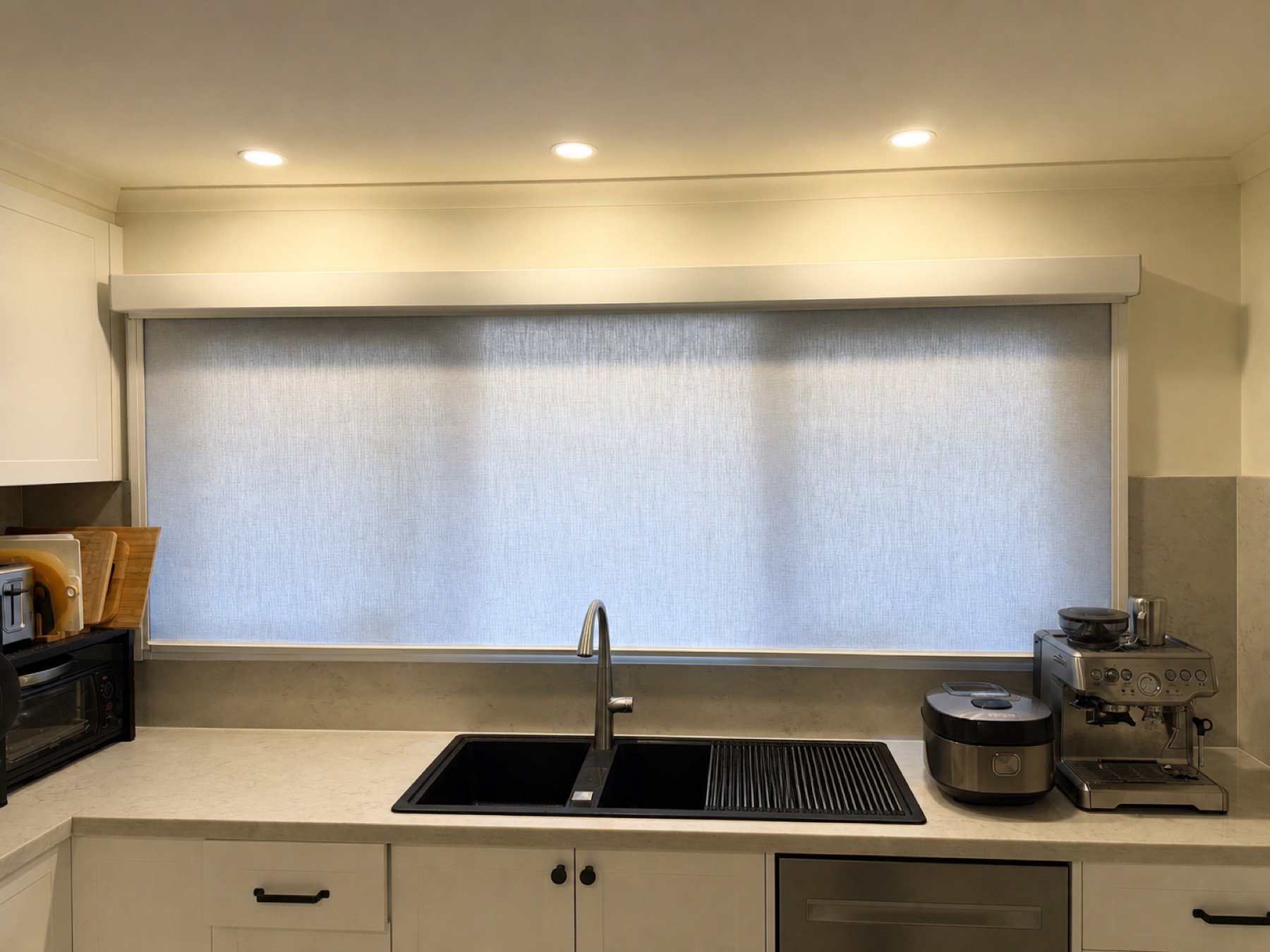 Ziptrak Interior blind installed above a kitchen bench with a clean pelmet and side tracks