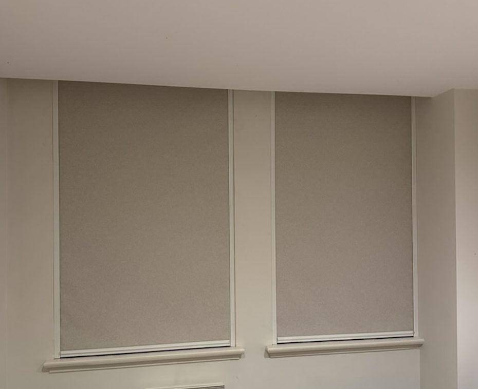 Two Ziptrak Interior blinds lowered across adjacent windows