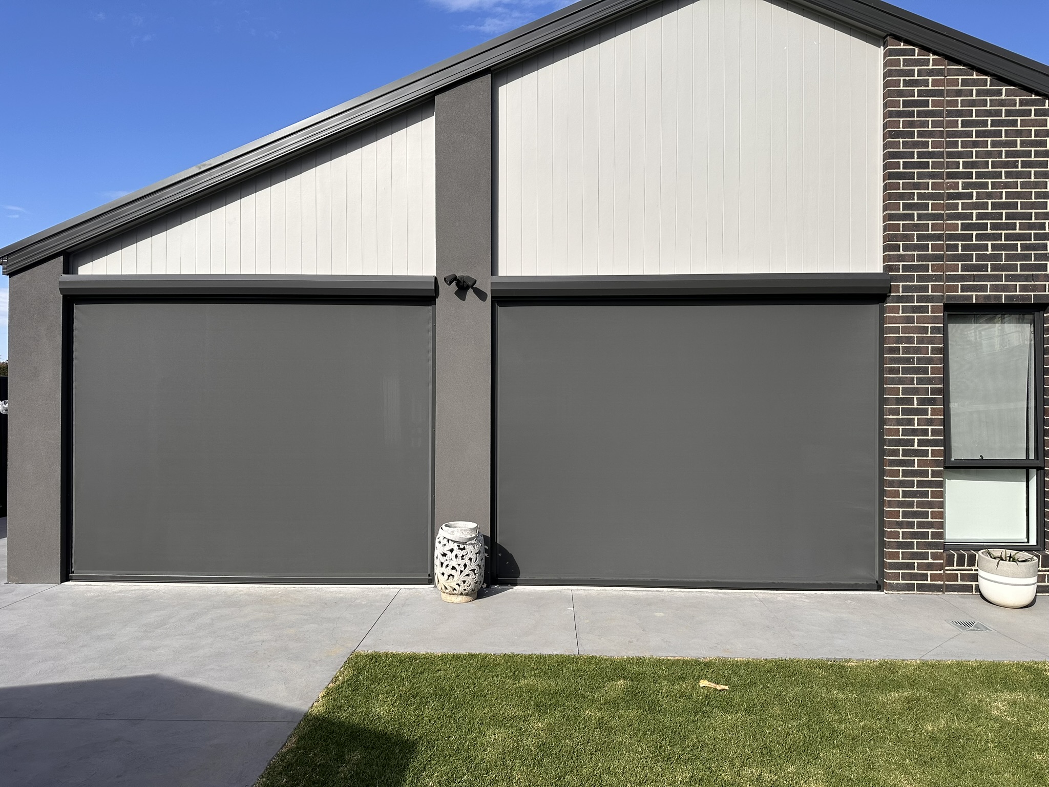 Ziptrak blinds installed on a modern residential exterior